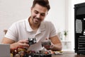 Male technician repairing computer at table Royalty Free Stock Photo