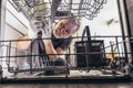 Male Technician Repairing Dishwasher In Kitchen Royalty Free Stock Photo