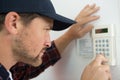 Male technician repairing intercom