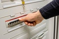 Male Technician Touching Electric Fuse At Datacenter