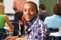 Male Teenage Pupil In Classroom