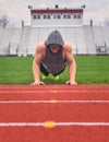 Male Teenager Doing Push Ups On Empty Football Field Royalty Free Stock Photo