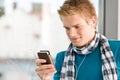 Male teenager with mp3 player and earbuds Royalty Free Stock Photo