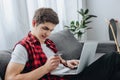 male teenager using laptop and paying with credit card Royalty Free Stock Photo