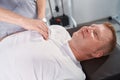 Male therapist massages table therapy for sport trauma patient close up