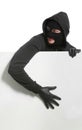 Male thief with blank poster on white background