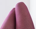 Male thighs in pink zigzag pantyhose