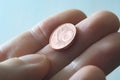 A male thumb and index finger gripping a one Euro cent Coin. Royalty Free Stock Photo