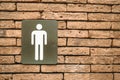 Male toilet symbols on red brick walls Royalty Free Stock Photo