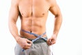 Male torso and blue tape measure Royalty Free Stock Photo