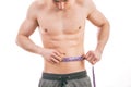 Male torso and blue tape measure Royalty Free Stock Photo