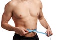 Male torso with measure tape on waistline Royalty Free Stock Photo