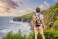 Male tourist on the background of beautiful rocks and the sea. Hiking concept. Tobizin cape. Vladivostok, island Russky