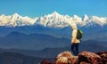 Tourist hiker enjoy view of the Himalaya mountain range at Uttarakhand Indiae from Binsar Uttarakhand India. Royalty Free Stock Photo