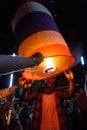 A male tourist releases a floating lantern in Chiang Mai, Thailand