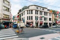 Male tourist riding a bicycle along the street in Taipei, Taiwan