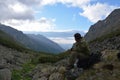 Male tourist sits in the mountains of the Barguzin ridge at Lake Royalty Free Stock Photo