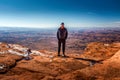 Tourist standing at the Needles Overlook to the Canyonlands National Park, Utah Royalty Free Stock Photo