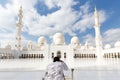 Male tourist taking photo Sheikh Zayed Grand Mosque in Abu Dhabi, the capital city of United Arab Emirates