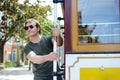 Male tourist taking a ride in famous cable car in San Francisco Royalty Free Stock Photo