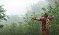 Male tourist on top of mountain in fog in autumn Royalty Free Stock Photo