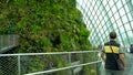 Male tourist walking at Cloud Forest, Gardens by the Bay in Singapore