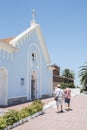 Male tourists going towards the entrance of the Church of Our Lady of Candelaria