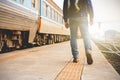 Male tourists are walking at the train station Royalty Free Stock Photo
