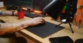 Male trader uses computer mouse, types on keyboard, analyzes real-time stocks Royalty Free Stock Photo