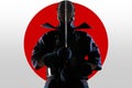 Male in tradition kendo armor with Samurai sword katana on red moon and white background. Royalty Free Stock Photo