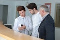 Male trainee receptionists in receptionist class Royalty Free Stock Photo