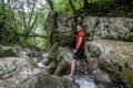 A male traveler admires the canyon of the Agura River in Sochi Royalty Free Stock Photo