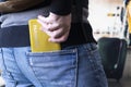 a male traveler with a backpack takes his passport out of his back pocket at the airport Royalty Free Stock Photo