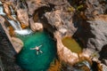 A male traveler bathes in a cold mountain river. To swim at Sapadere canyon and waterfall, Nature, Travel and vacation concept.