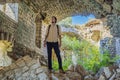 Male traveler in Collapsing tower of fortress Kosmac. Ancient Austro-Hungarian fortress built as a defensive structure