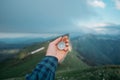 Traveler male hand with compass outdoor. Royalty Free Stock Photo