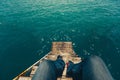 Male Traveler Sitting On Pier With Summer Sea View. Travel Lifestyle Adventure Vacations Concept