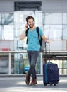 Male traveler talking on mobile phone