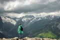 Male traveller on the top of mountain stormy landscape Royalty Free Stock Photo