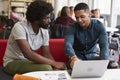 Male University Student Working In Library With Tutor Royalty Free Stock Photo