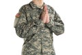 Male in US Army soldier uniform praying