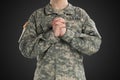 Male in US Army soldier uniform praying