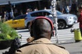 MALE USES HEADPHONE TO LISTEN MUSIC IN COPENHAGEN