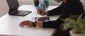 Male using digital tablet on white table in home office room Royalty Free Stock Photo