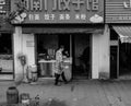 Male Chinese street vendor selling food in China