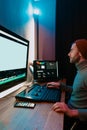 Male Video Editor Working on His Personal Computer with Big blank Display Royalty Free Stock Photo