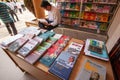Male vietnamese reading book in book store, books which focus on Vo Nguyen Giap is considered one of the greatest military