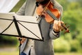 Male violinist playing his instrument