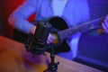 Male vlogger recording music related broadcast at studio Royalty Free Stock Photo