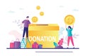 Male volunteer puts gold coin into donation box. Business people donate money. Concept charity fundraising, financial support and